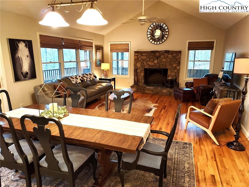 247 Hawkbill Road Ferguson, NC 28624 - Photo 4 of 25 a living room with furniture a fireplace and a large window