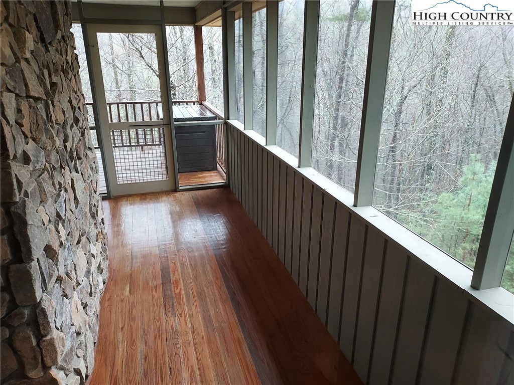 247 Hawkbill Road Ferguson, NC 28624 - Photo 5 of 25 a view of a balcony with wooden floor