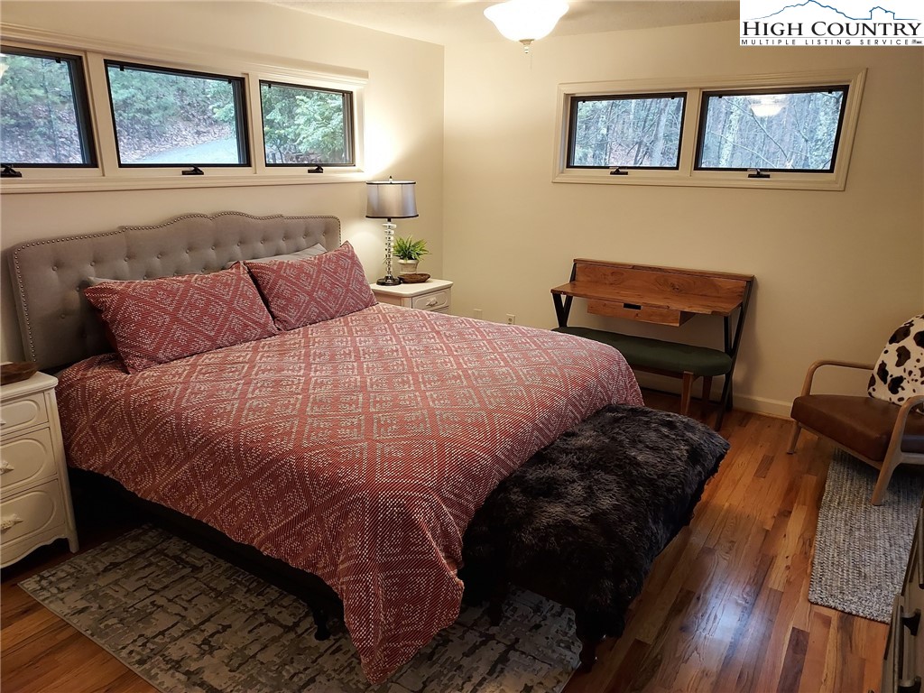 247 Hawkbill Road Ferguson, NC 28624 - Photo 6 of 25 a bedroom with bed and window