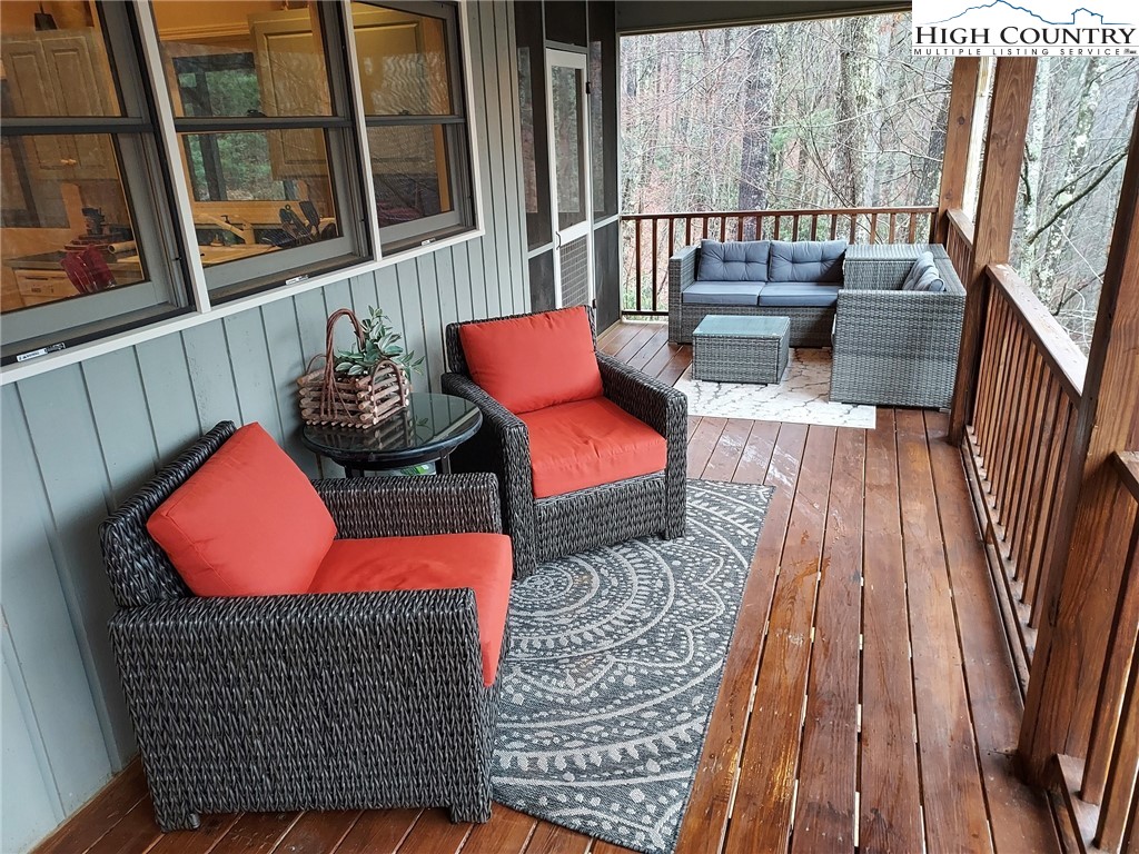 247 Hawkbill Road Ferguson, NC 28624 - Photo 9 of 25 a outdoor living room with furniture and a fireplace