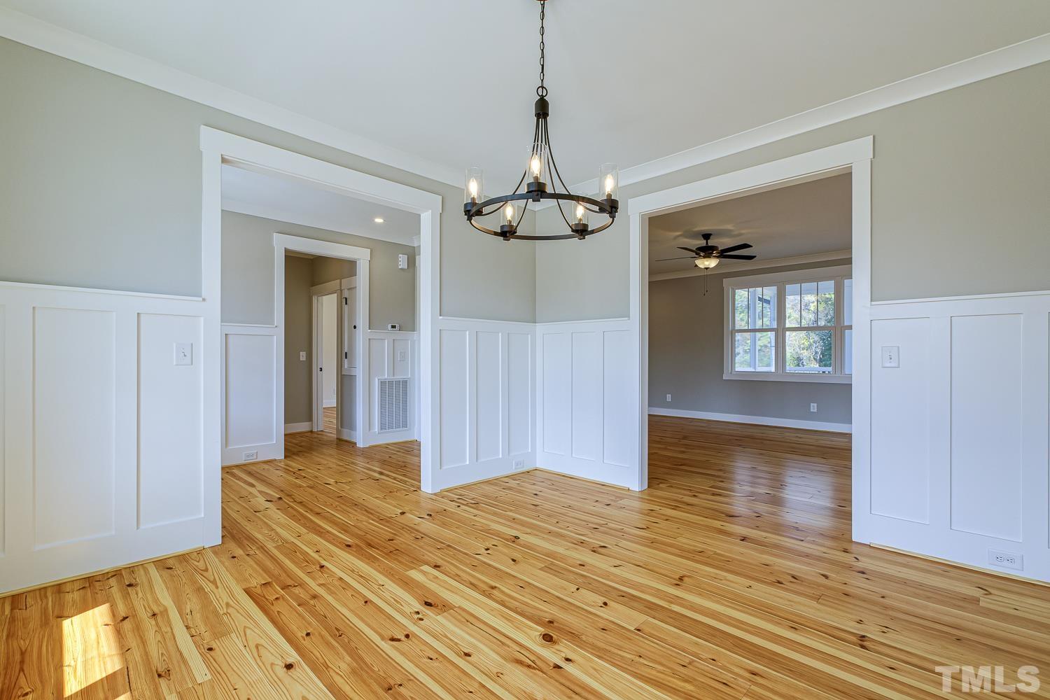 742 River Road Fuquay-Varina, NC 27526 - Photo 11 of 68 a bedroom with a bed and wooden floor