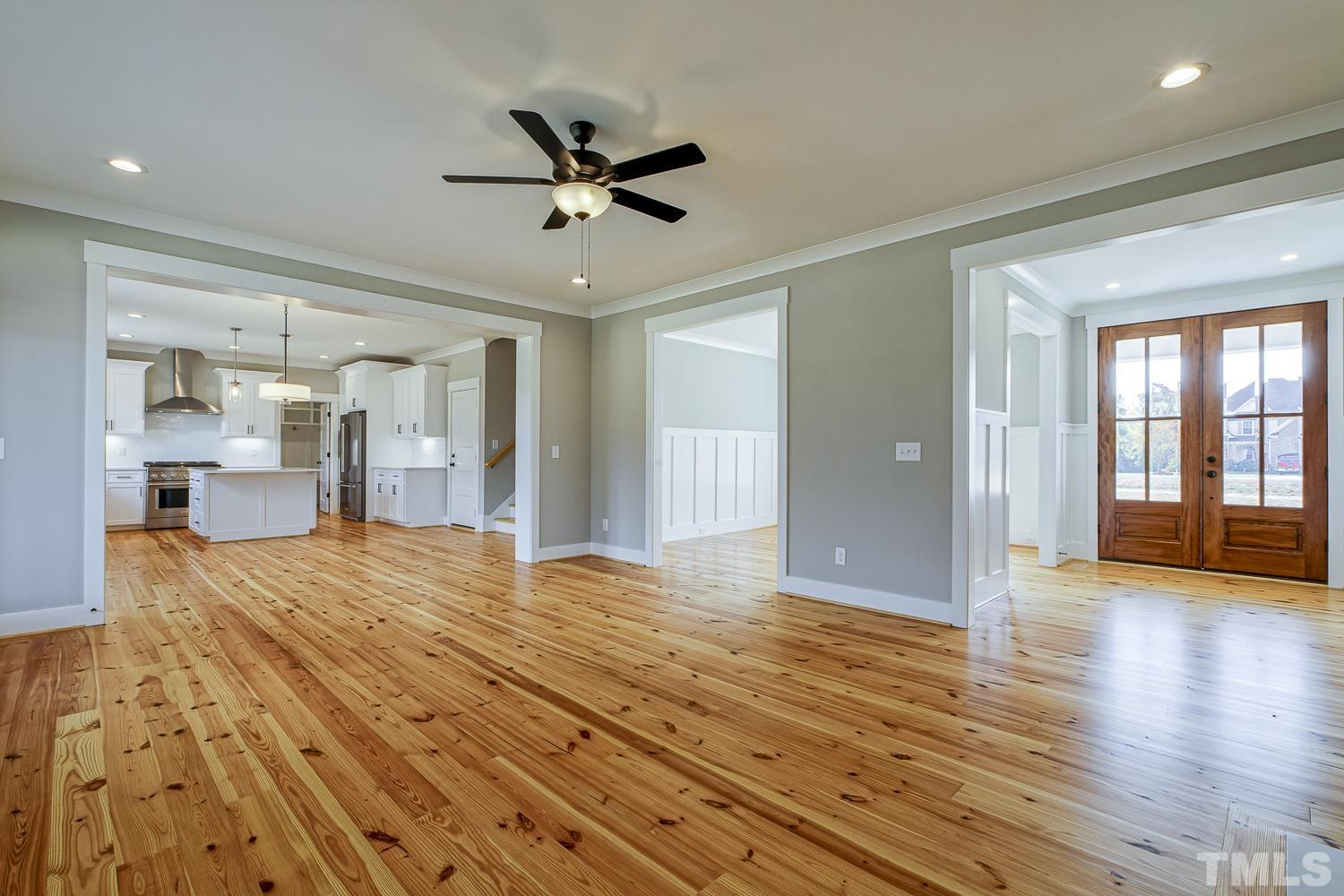 742 River Road Fuquay-Varina, NC 27526 - Photo 14 of 68 a view of empty room with wooden floor and fan