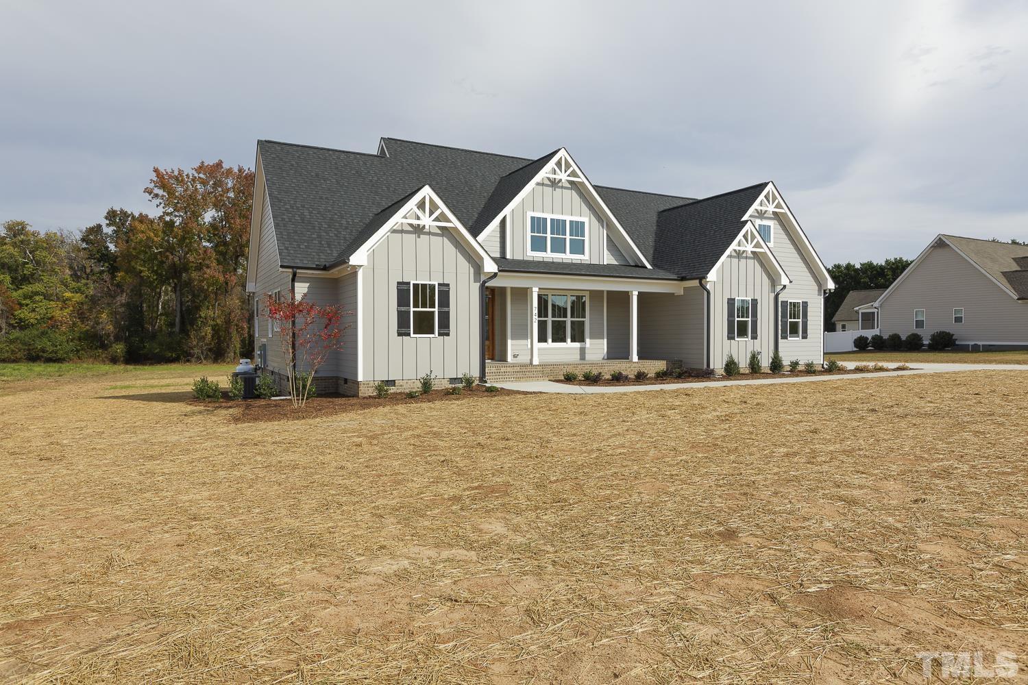 742 River Road Fuquay-Varina, NC 27526 - Photo 2 of 68 a front view of a house with a yard