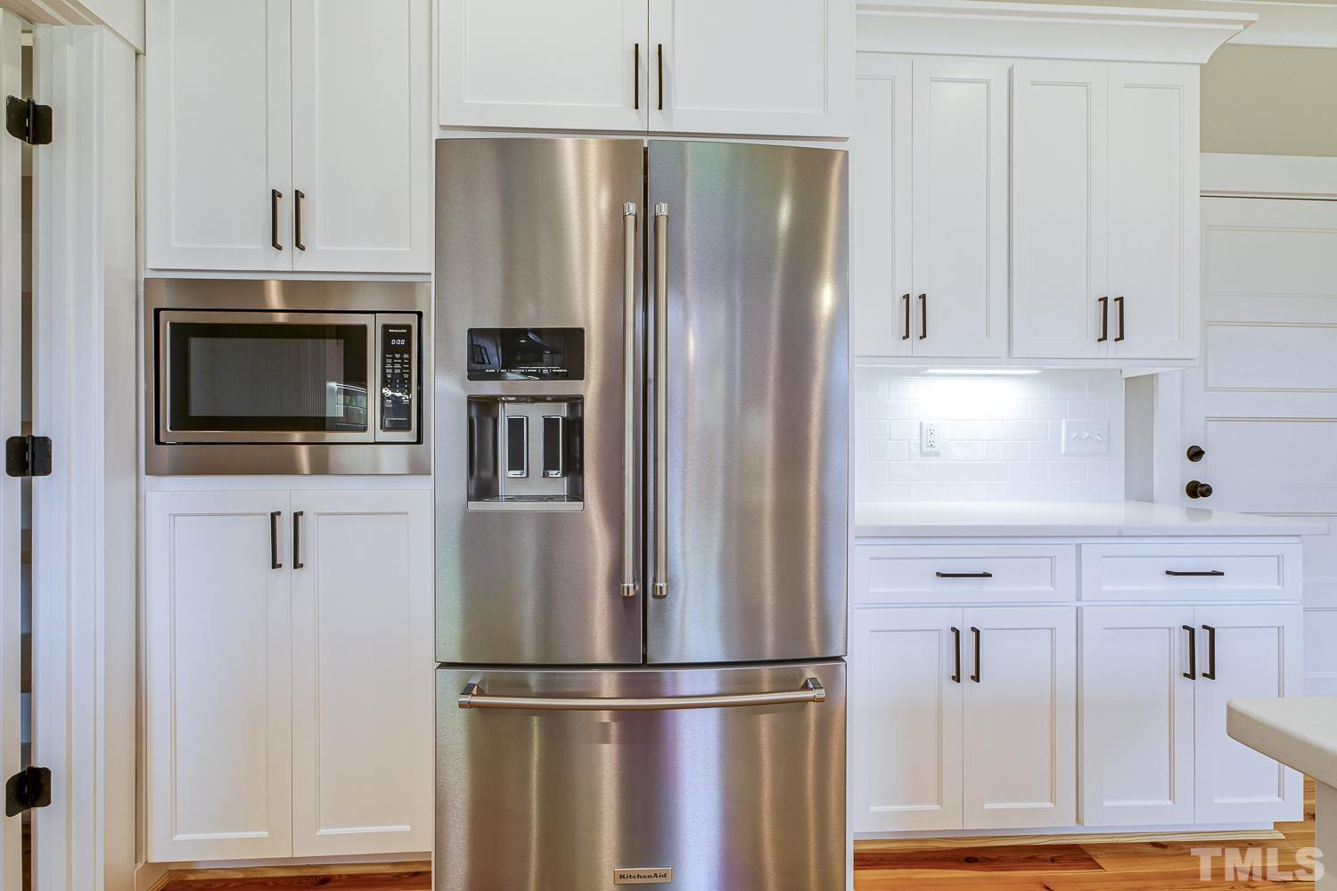 742 River Road Fuquay-Varina, NC 27526 - Photo 26 of 68 a kitchen with stainless steel appliances and refrigerator