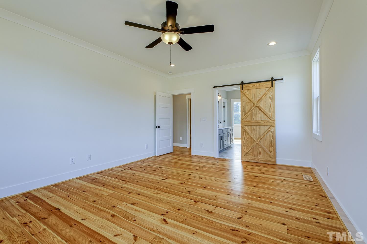 742 River Road Fuquay-Varina, NC 27526 - Photo 34 of 68 a view of empty room with wooden floor