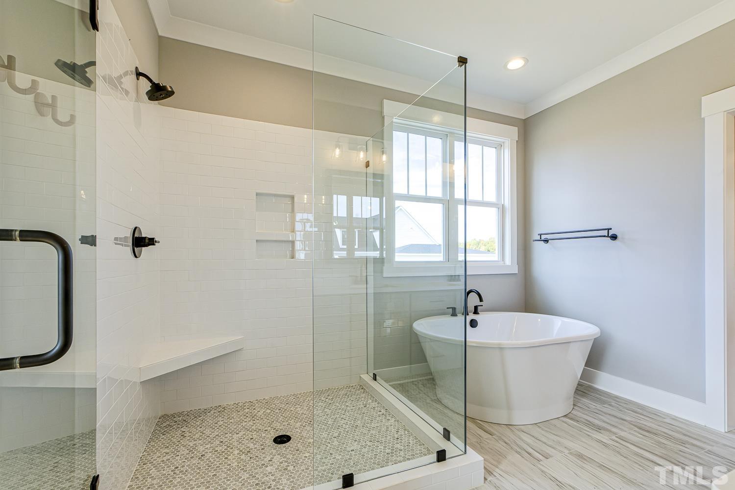 742 River Road Fuquay-Varina, NC 27526 - Photo 39 of 68 a bathroom with a bathtub and shower