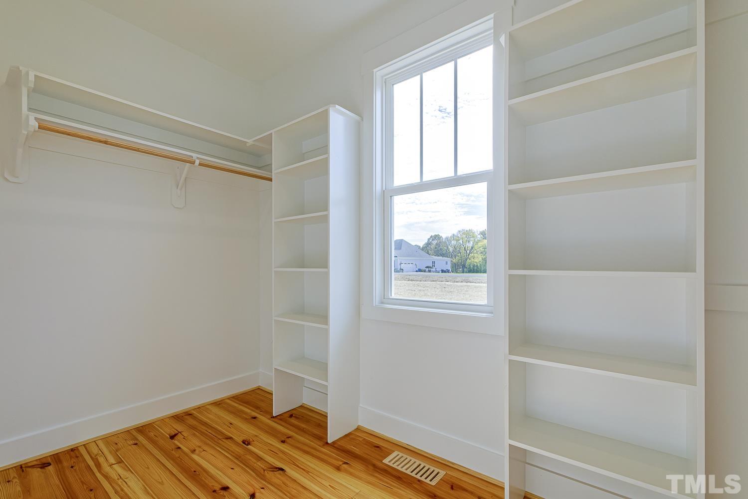 742 River Road Fuquay-Varina, NC 27526 - Photo 41 of 68 a bathroom with a bathtub and a window