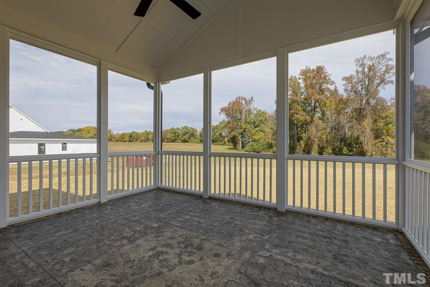 742 River Road Fuquay-Varina, NC 27526 - Photo 43 of 68 a view of a porch with a floor to ceiling window and outside view