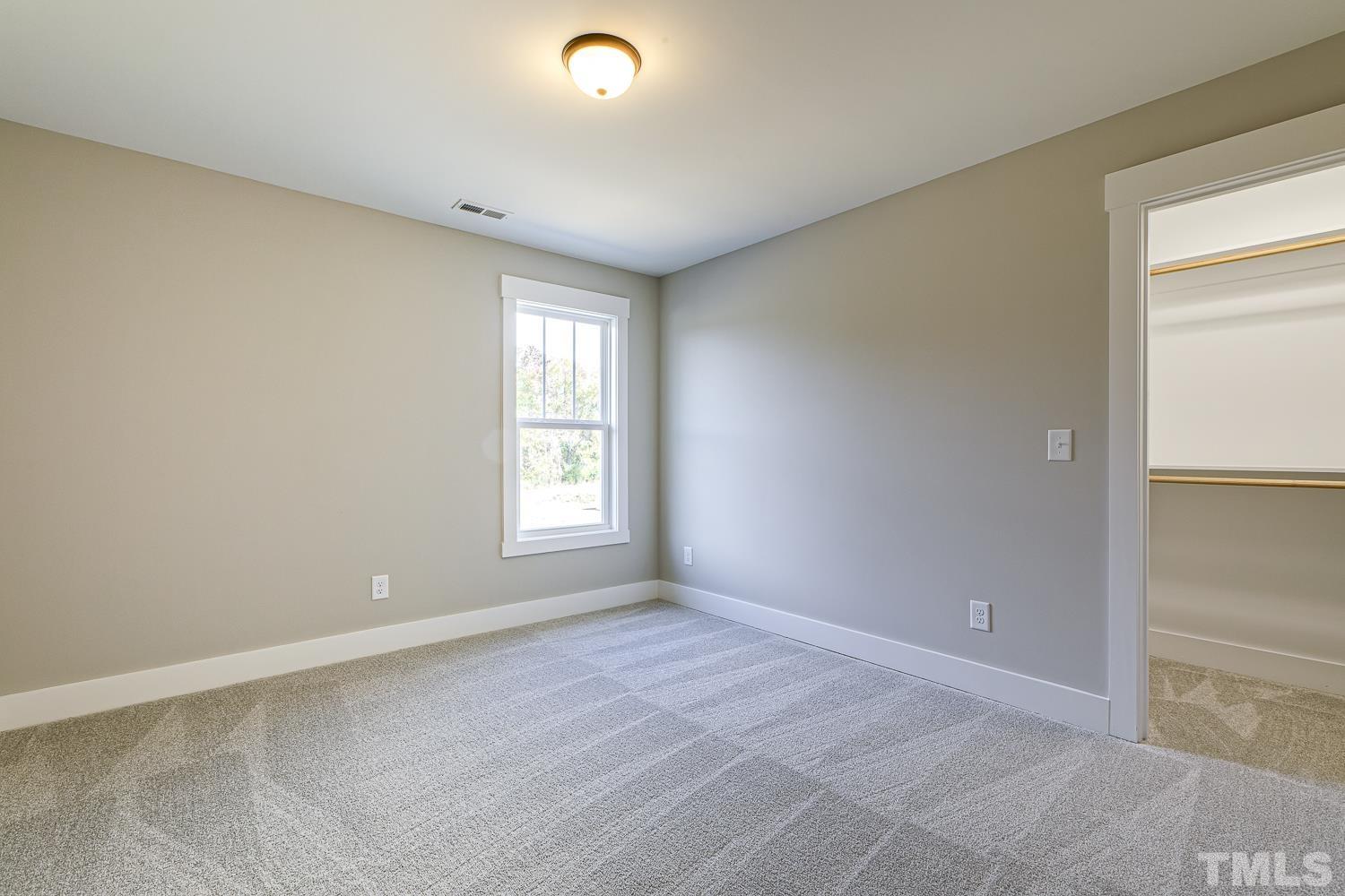 742 River Road Fuquay-Varina, NC 27526 - Photo 50 of 68 an empty room with windows