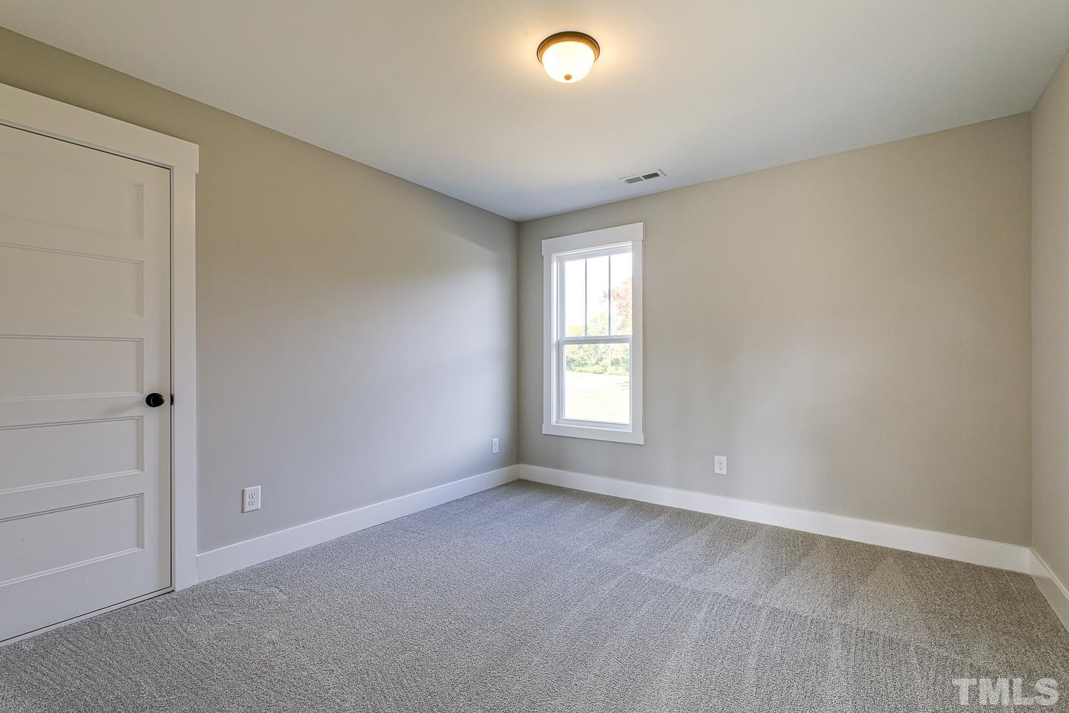 742 River Road Fuquay-Varina, NC 27526 - Photo 53 of 68 a view of an empty room with a window