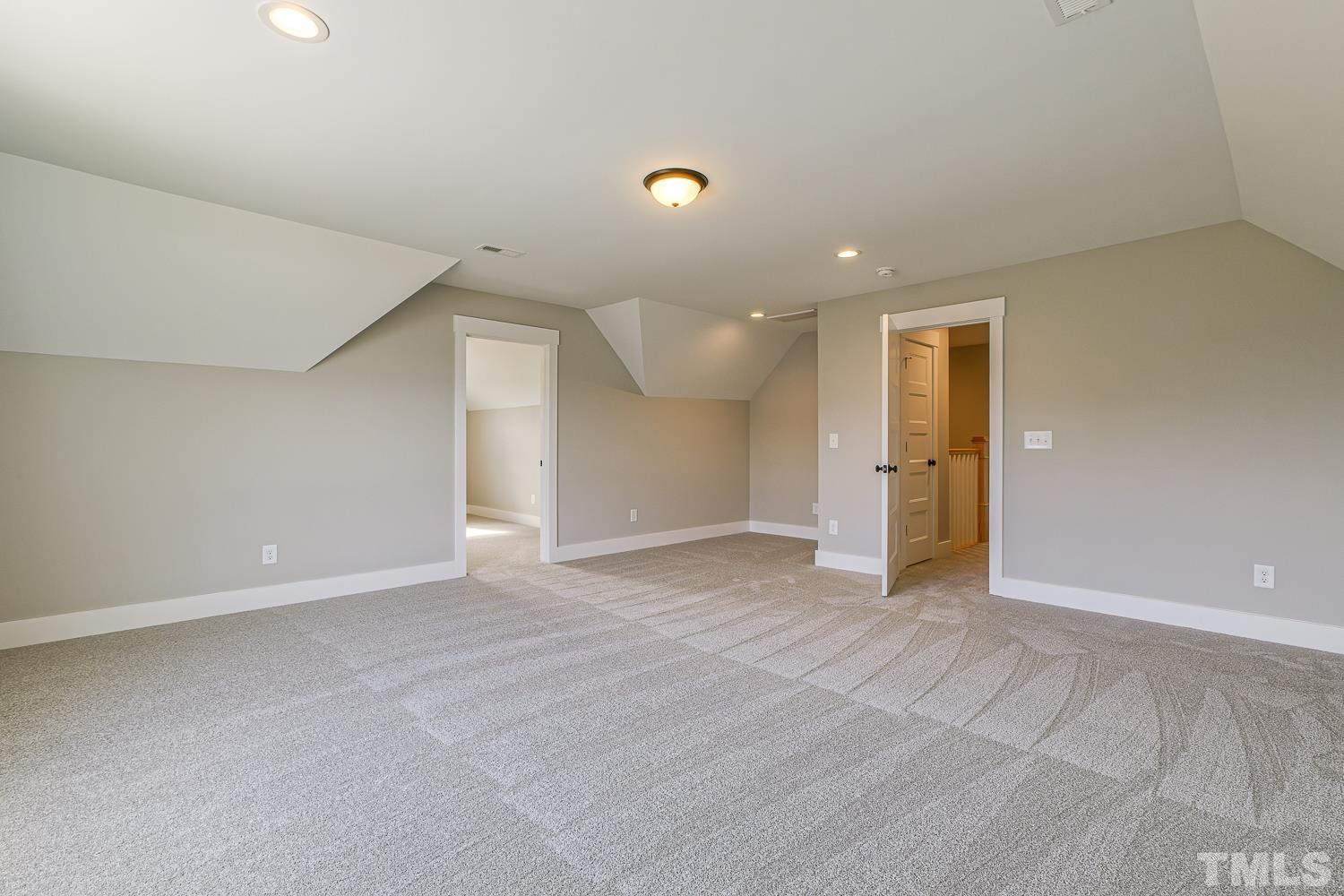742 River Road Fuquay-Varina, NC 27526 - Photo 58 of 68 a view of an empty room with a kitchen