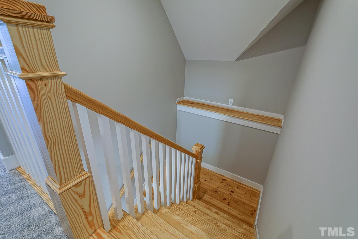 742 River Road Fuquay-Varina, NC 27526 - Photo 62 of 68 a view of a hallway with wooden floor and staircase