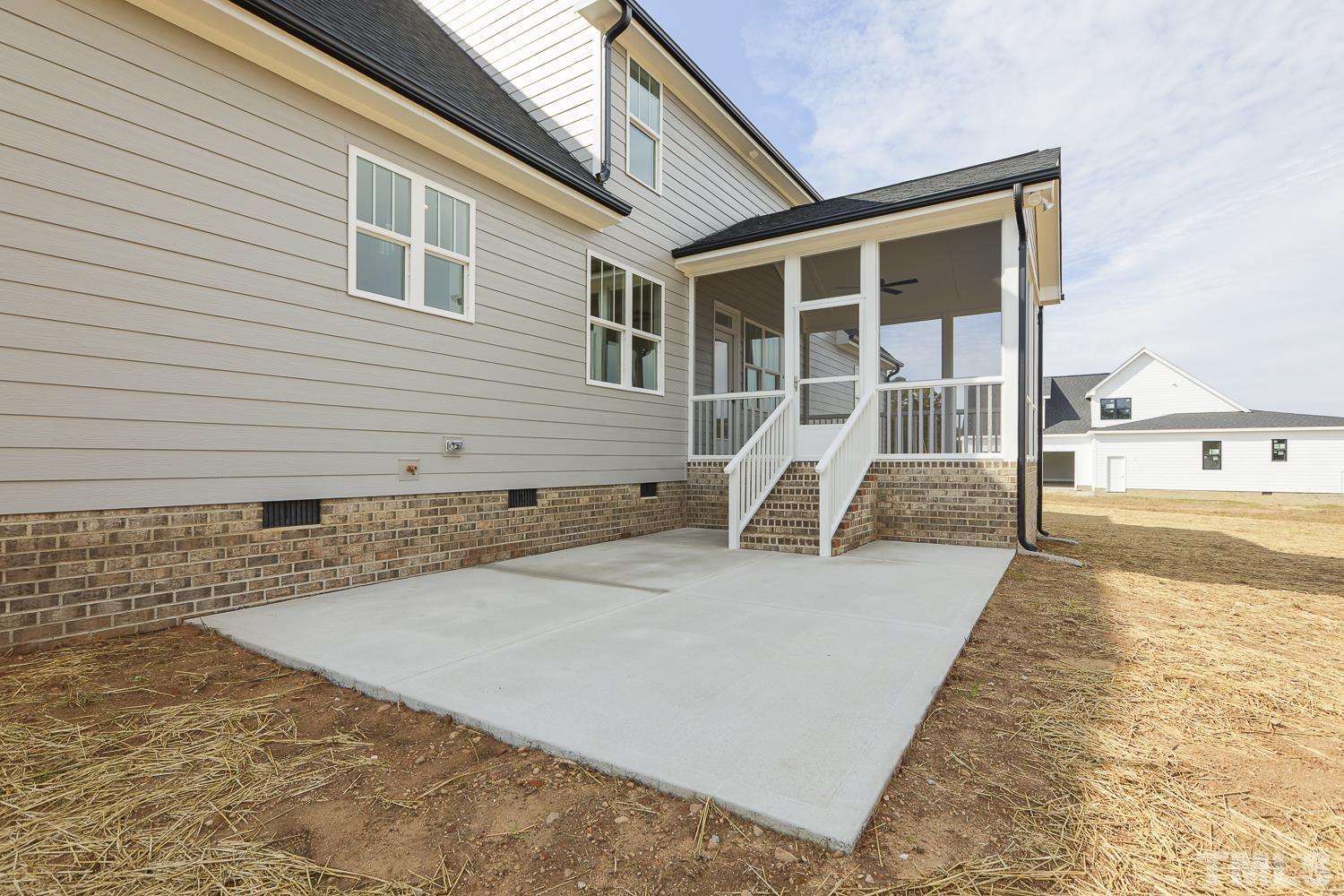 742 River Road Fuquay-Varina, NC 27526 - Photo 66 of 68 a view of a backyard with table and chairs
