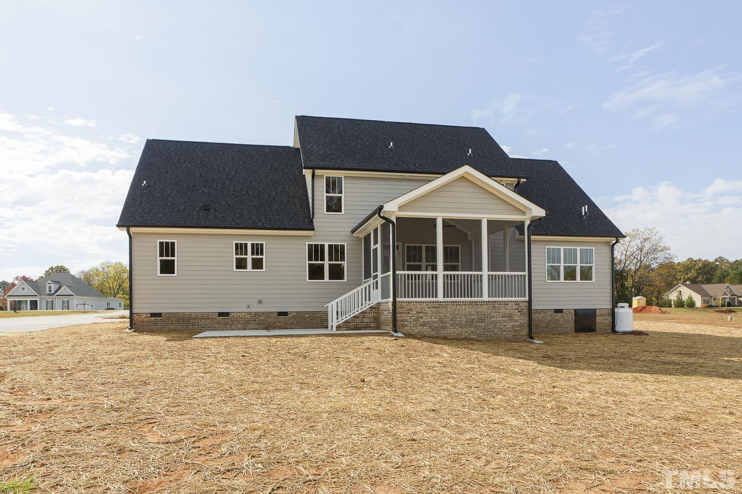742 River Road Fuquay-Varina, NC 27526 - Photo 67 of 68 a front view of a house with a yard
