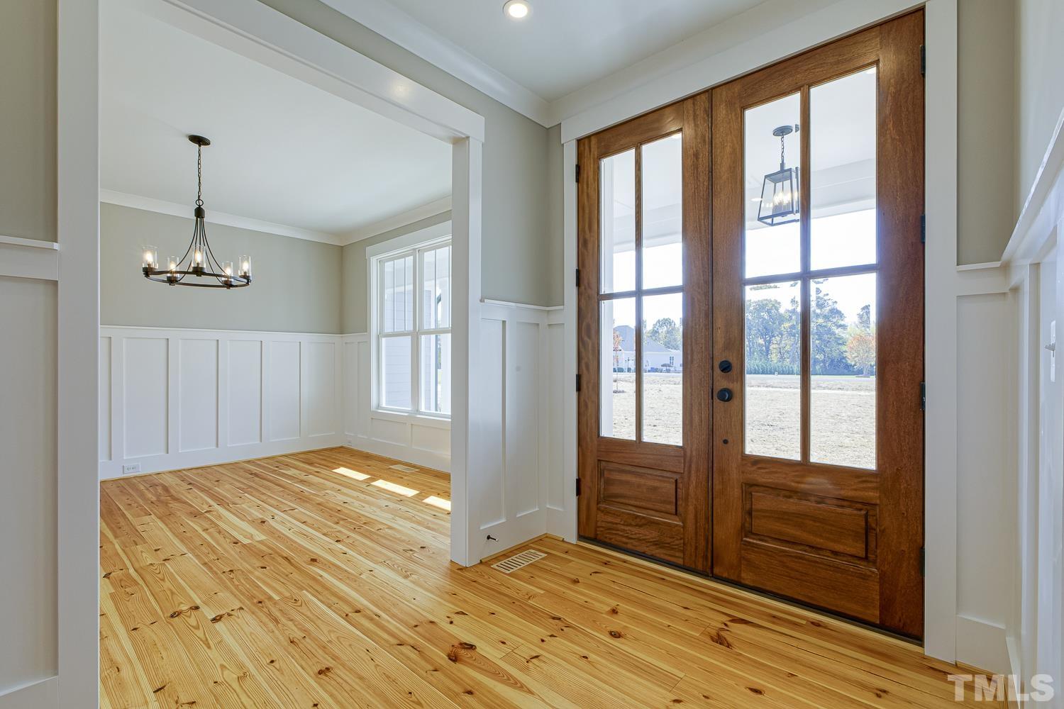 742 River Road Fuquay-Varina, NC 27526 - Photo 7 of 68 a bedroom with a bed and wooden floor