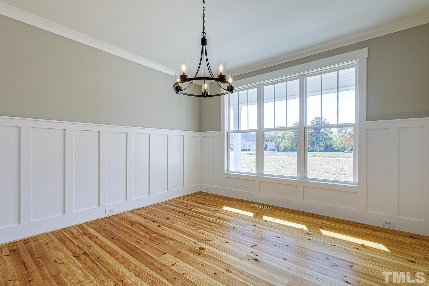 742 River Road Fuquay-Varina, NC 27526 - Photo 9 of 68 a view of a room with wooden floor chandelier and windows