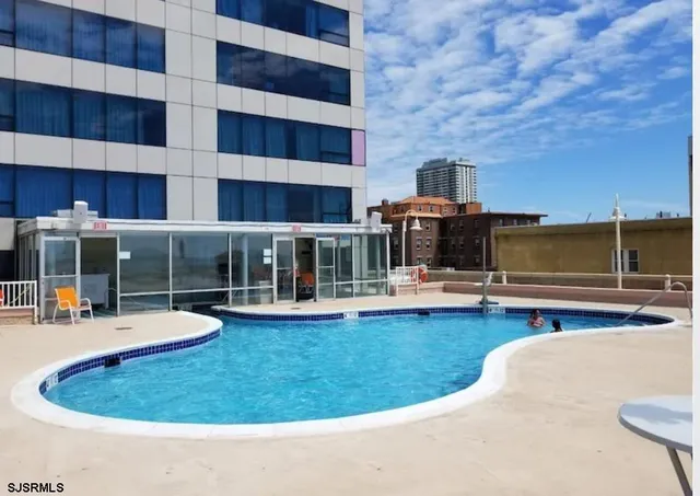 a view of a swimming pool with a lounge chairs
