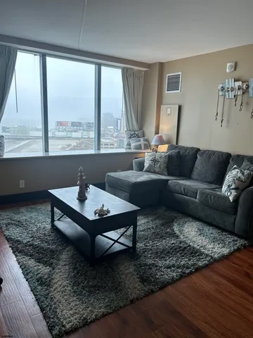 a living room with furniture and a large window