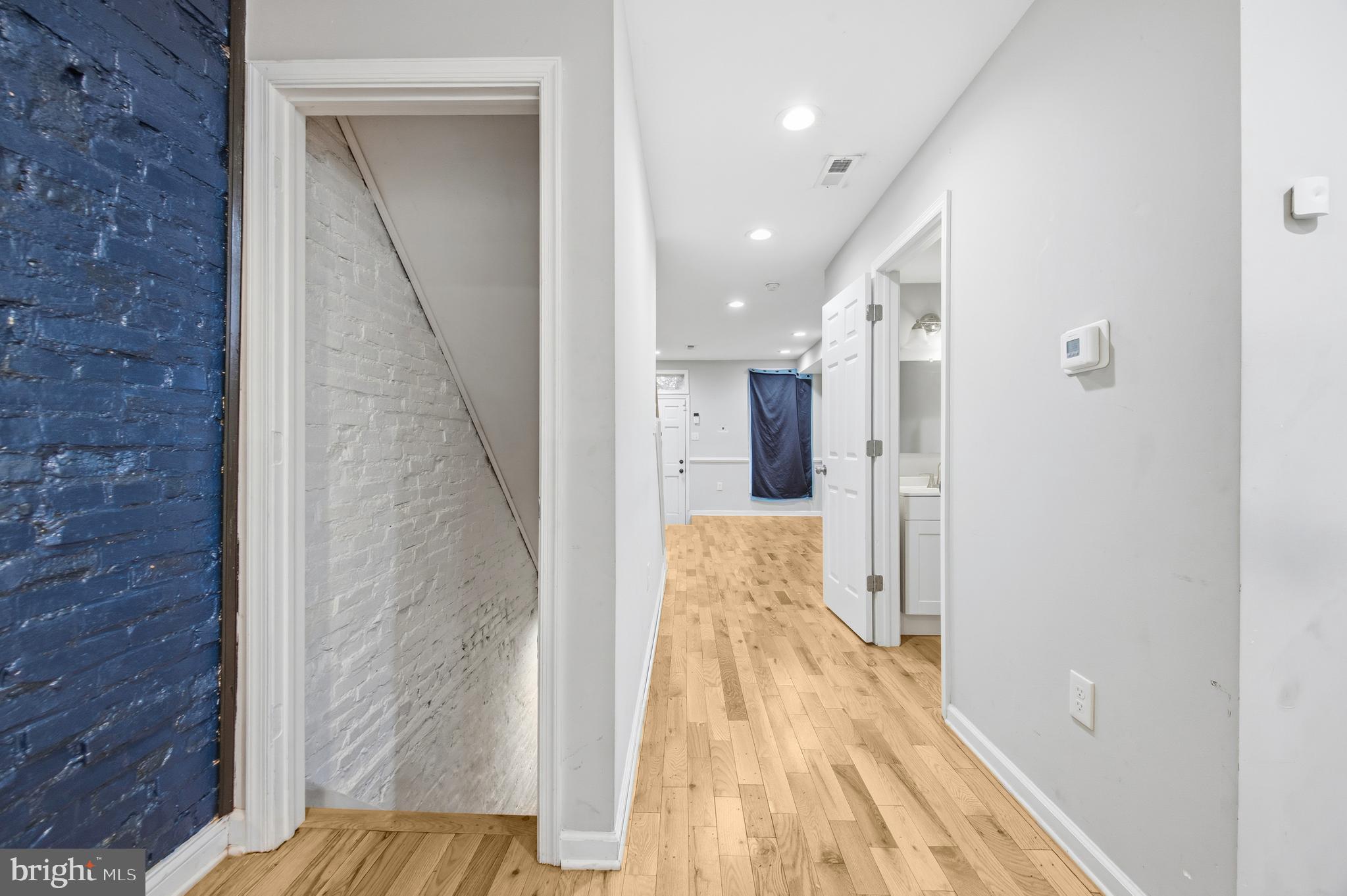 714 North Duncan Street Baltimore, MD 21205 - Photo 14 of 24 a view of a hallway with wooden floor and staircase