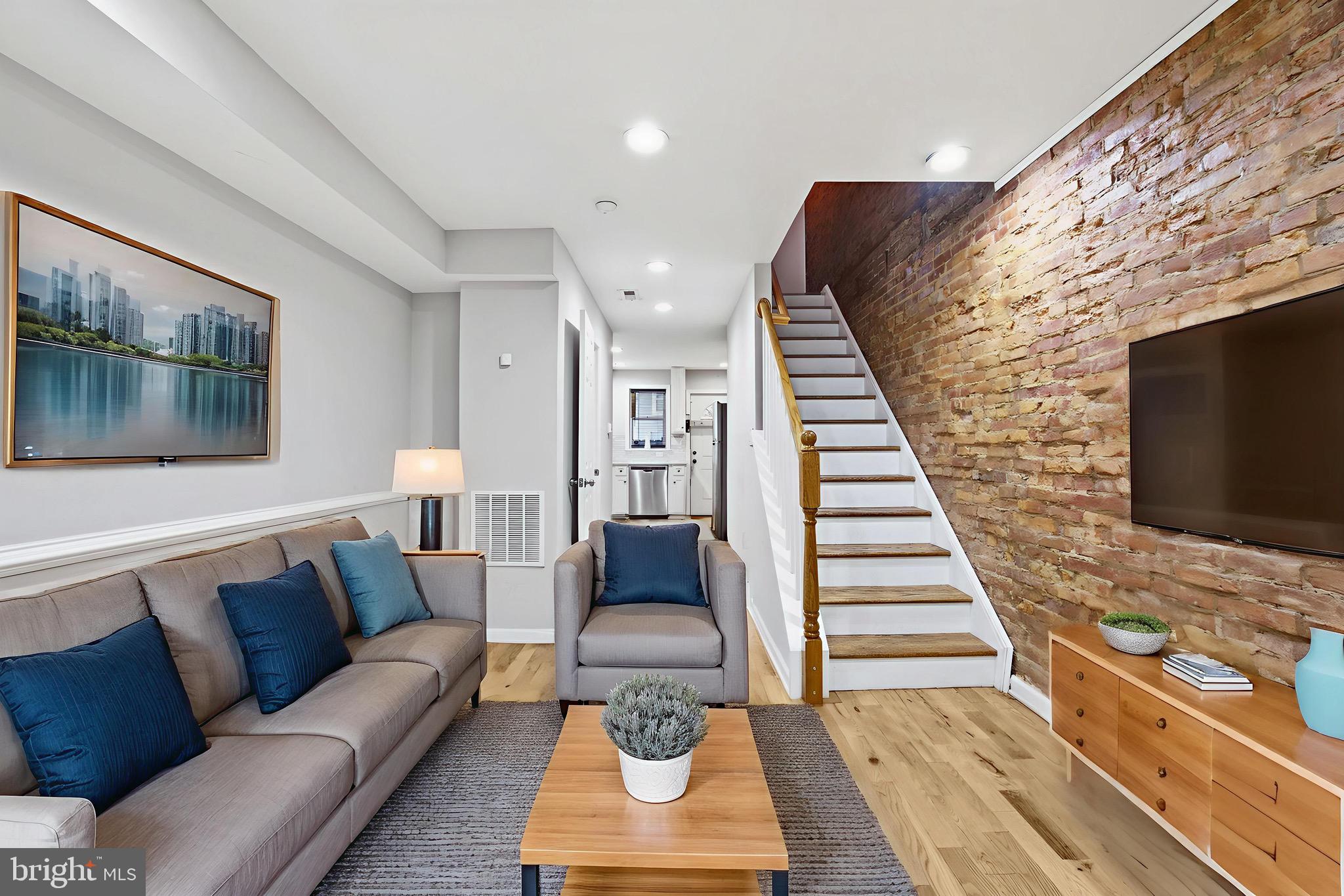 714 North Duncan Street Baltimore, MD 21205 - Photo 6 of 24 a living room with furniture and a flat screen tv