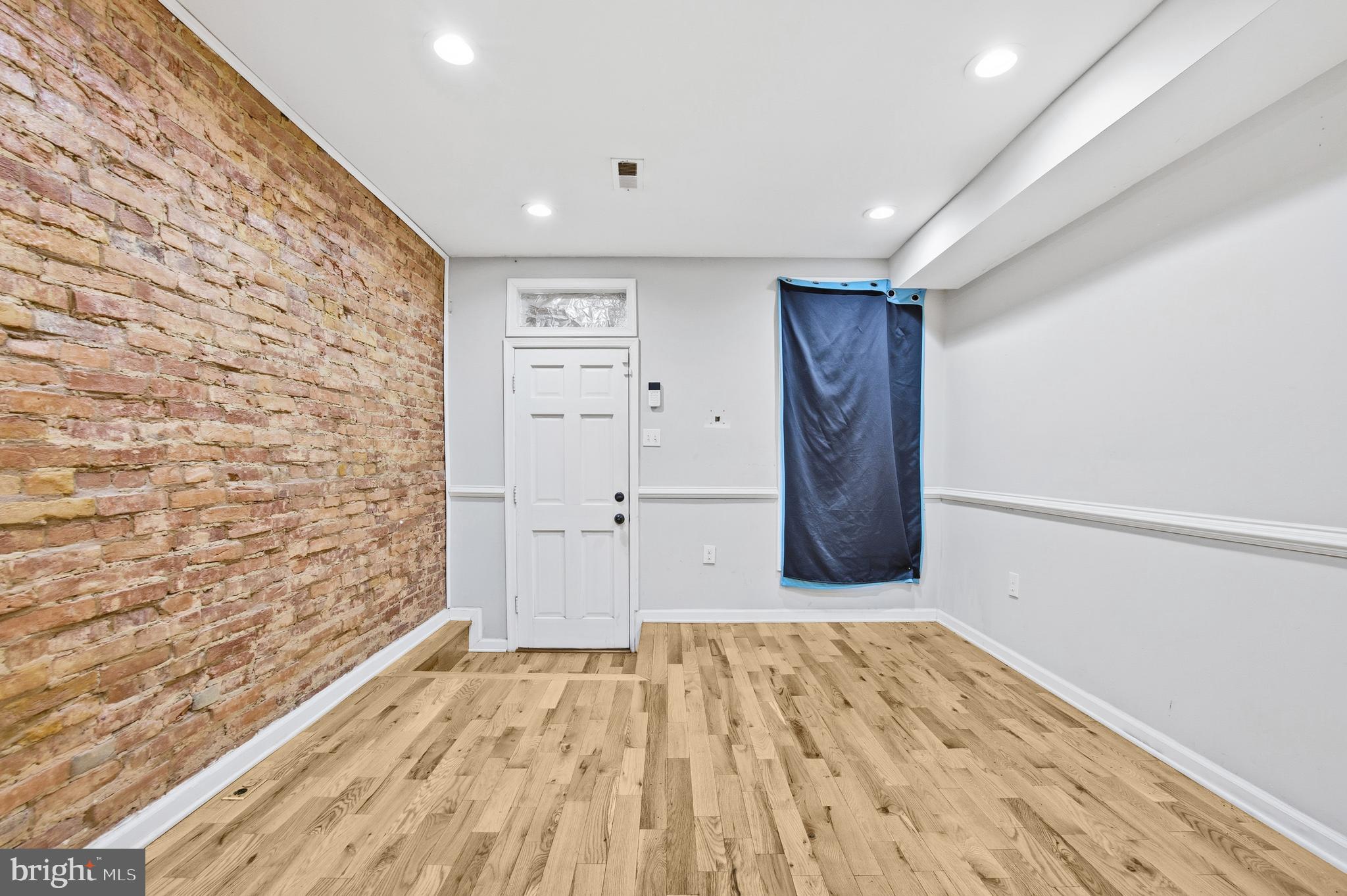 714 North Duncan Street Baltimore, MD 21205 - Photo 8 of 24 a view of a livingroom with wooden floor