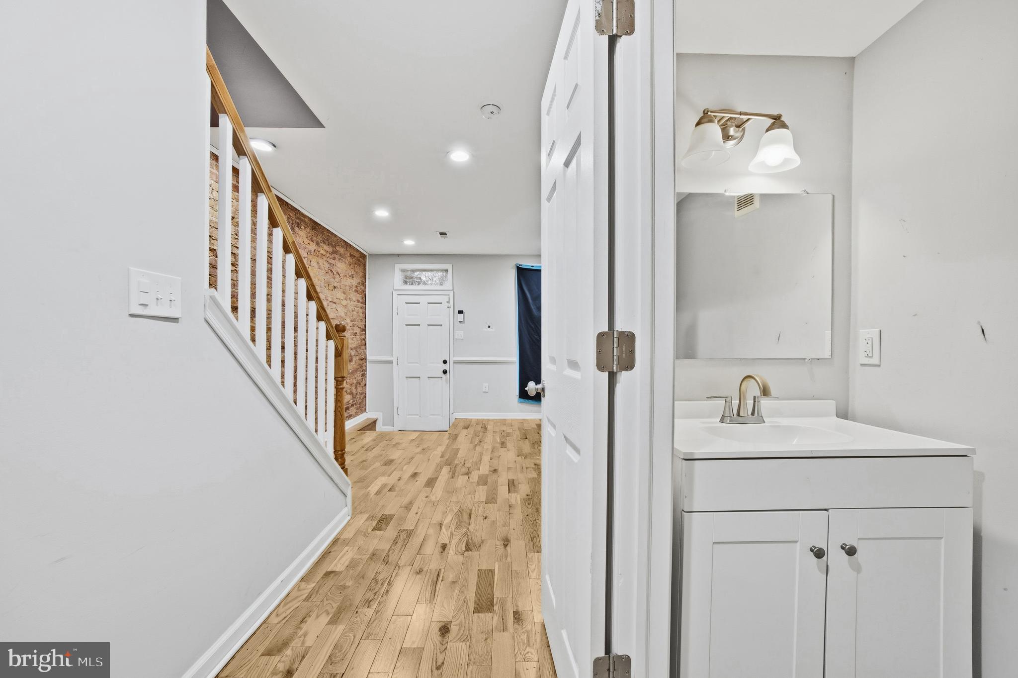 714 North Duncan Street Baltimore, MD 21205 - Photo 10 of 24 a bathroom with a sink and a mirror