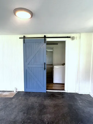 a bathroom with a sink toilet and a mirror