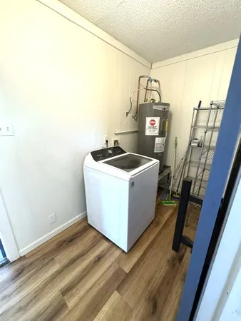 a view of kitchen and wooden floor