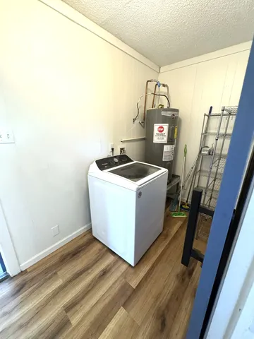 a bathroom with a sink toilet and a mirror