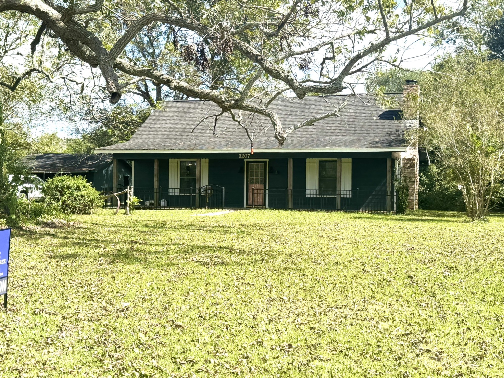 1207 Half Moon Drive Wharton, TX 77488 - Photo 2 of 50 a front view of a house with a garden