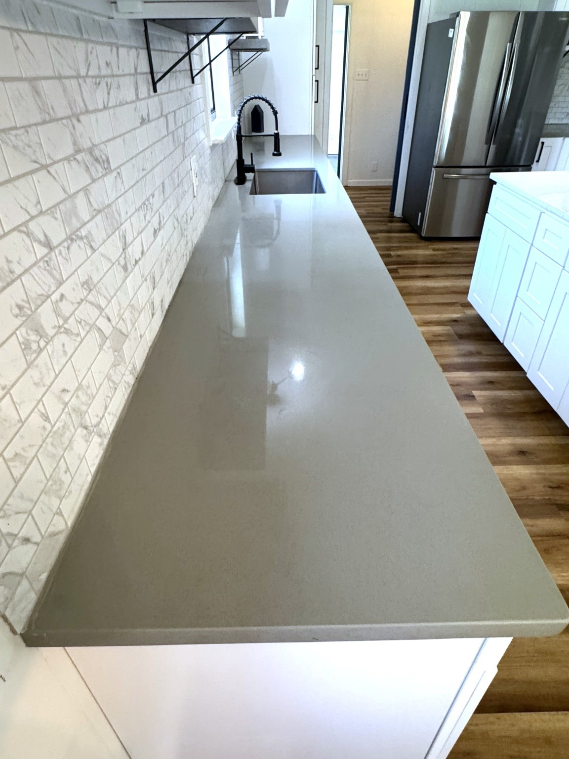 1207 Half Moon Drive Wharton, TX 77488 - Photo 23 of 50 a view of kitchen and wooden floor