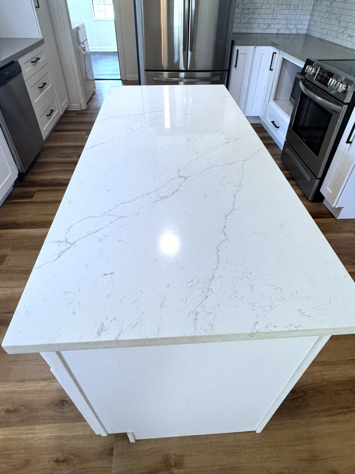 1207 Half Moon Drive Wharton, TX 77488 - Photo 24 of 50 a view of kitchen with stainless steel appliances wooden floor