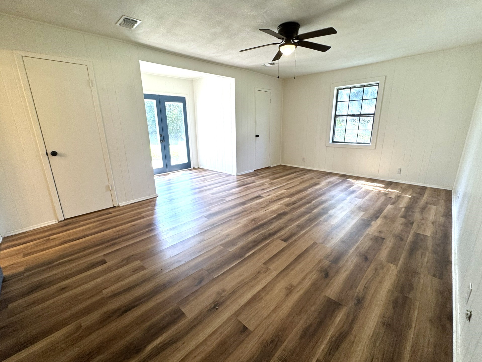 1207 Half Moon Drive Wharton, TX 77488 - Photo 34 of 50 wooden floor in an empty room with a window