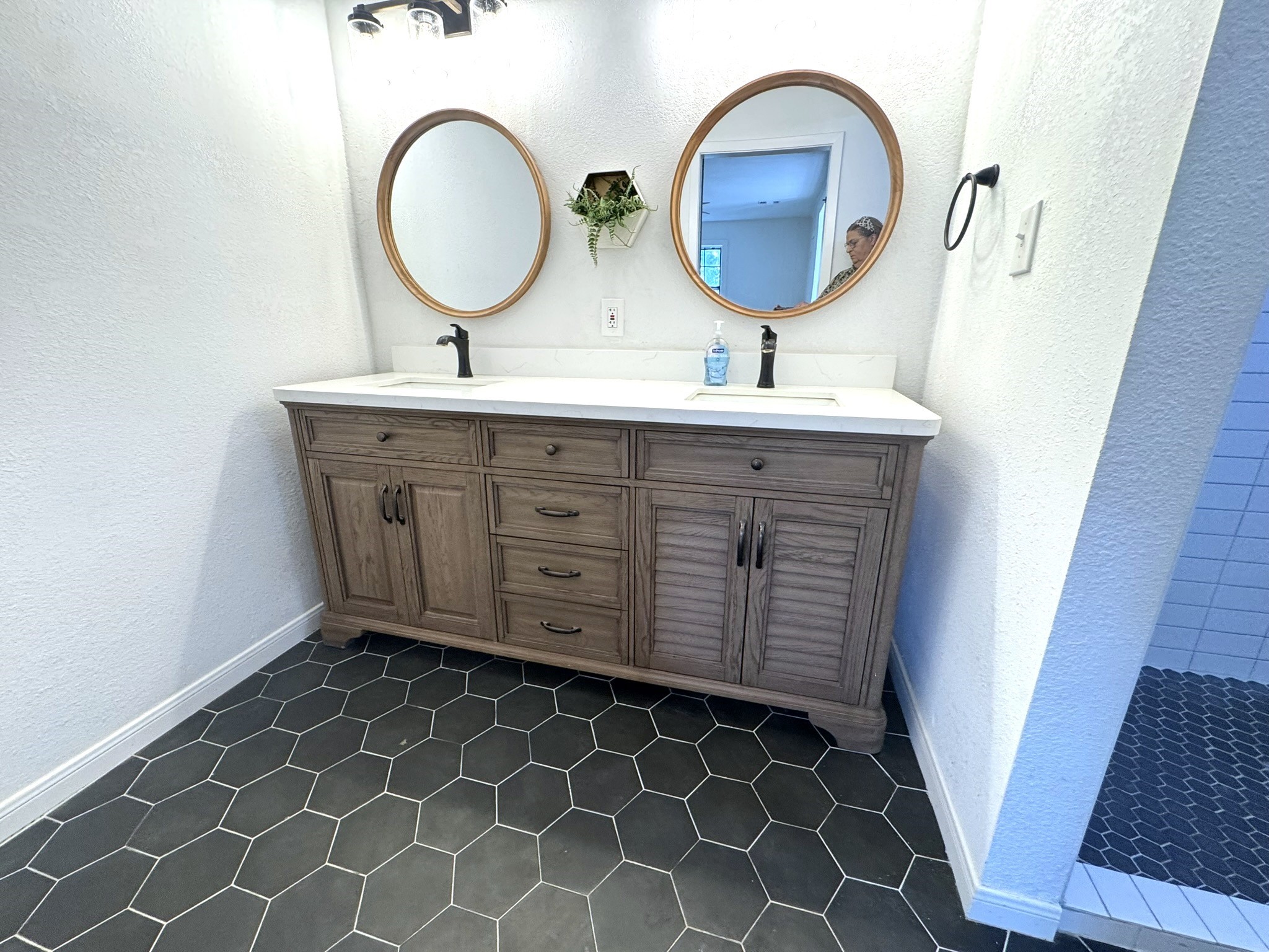 1207 Half Moon Drive Wharton, TX 77488 - Photo 41 of 50 a bathroom with a double vanity sink mirror and toilet
