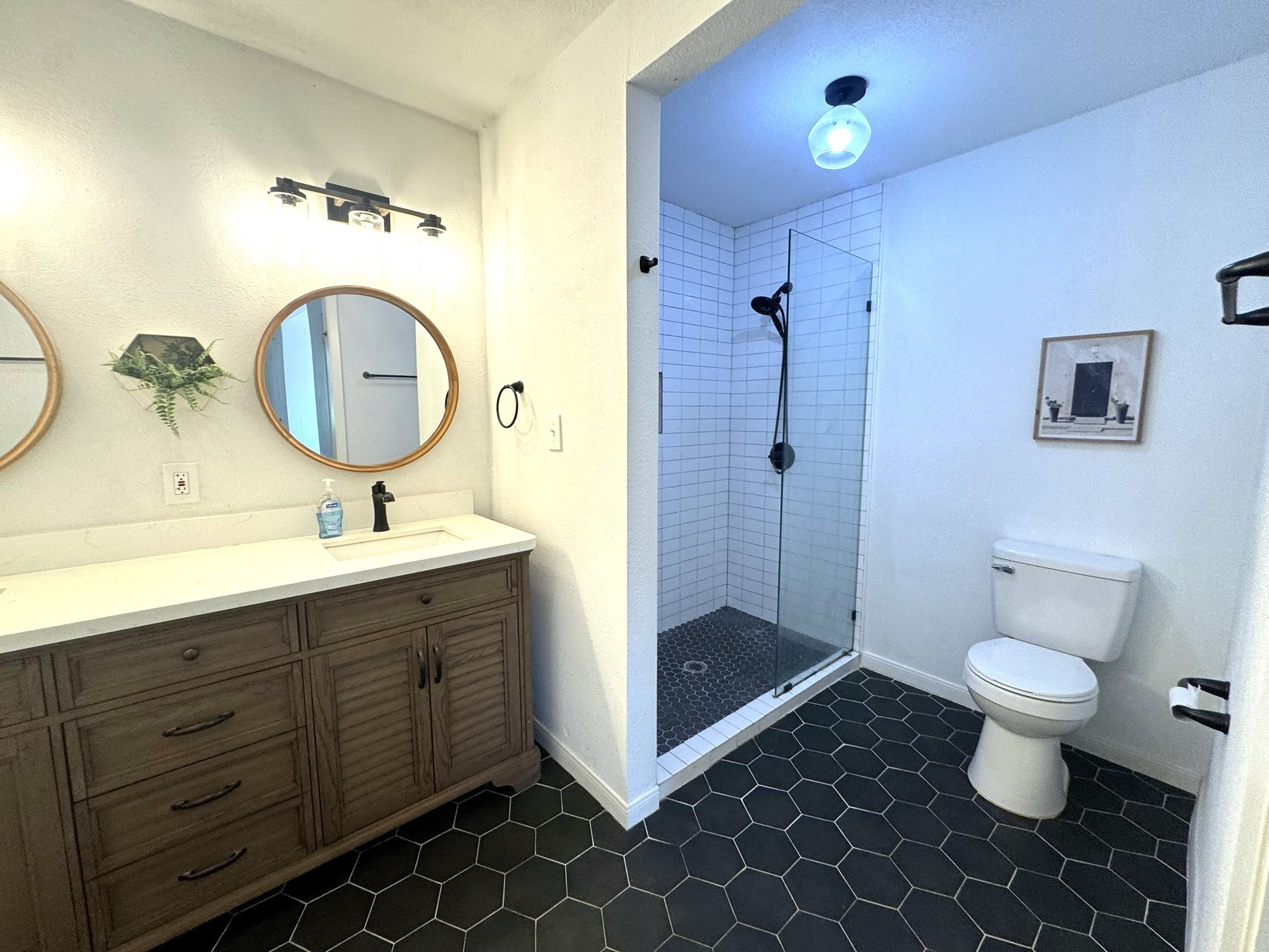 1207 Half Moon Drive Wharton, TX 77488 - Photo 42 of 50 a bathroom with a sink and a mirror