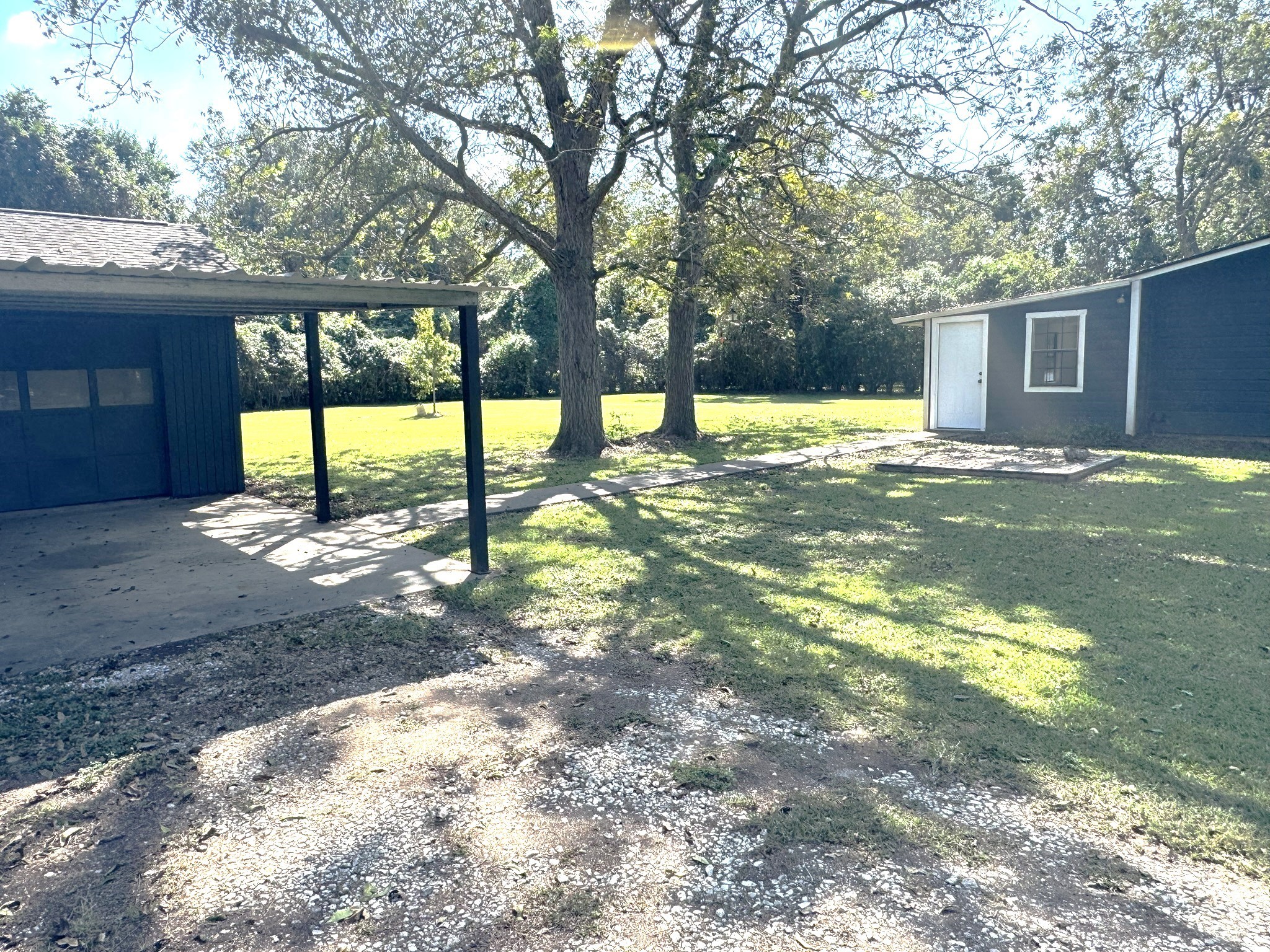 1207 Half Moon Drive Wharton, TX 77488 - Photo 7 of 50 a view of a yard with a tree