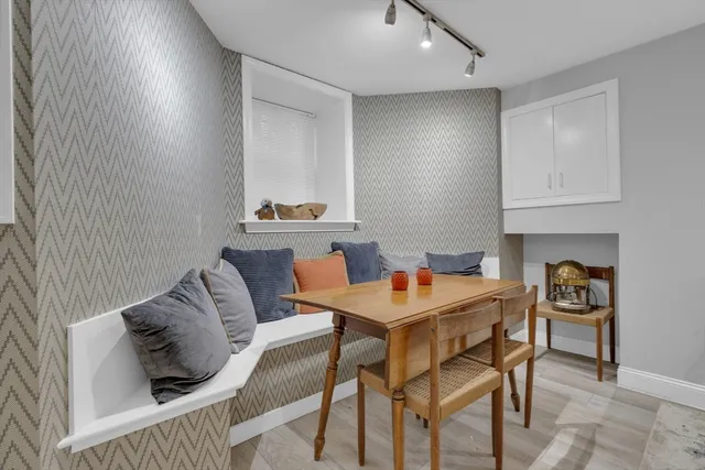 a view of a livingroom with furniture and a window