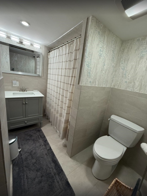 14 Auburn Street, Unit A Boston, MA 02129 - Photo 10 of 10 a bathroom with a toilet a sink and shower
