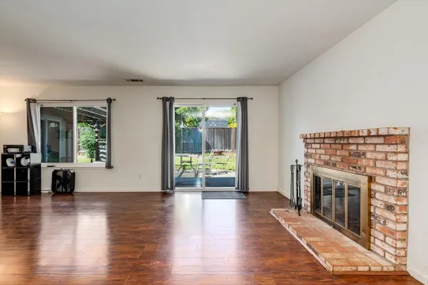 a view of livingroom with furniture wooden floor and window