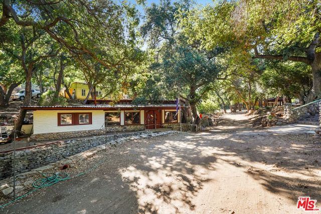 a dining room with furniture a chandelier and a rug