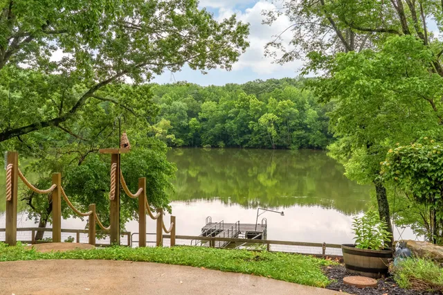 a spacious bedroom with a bed and large windows