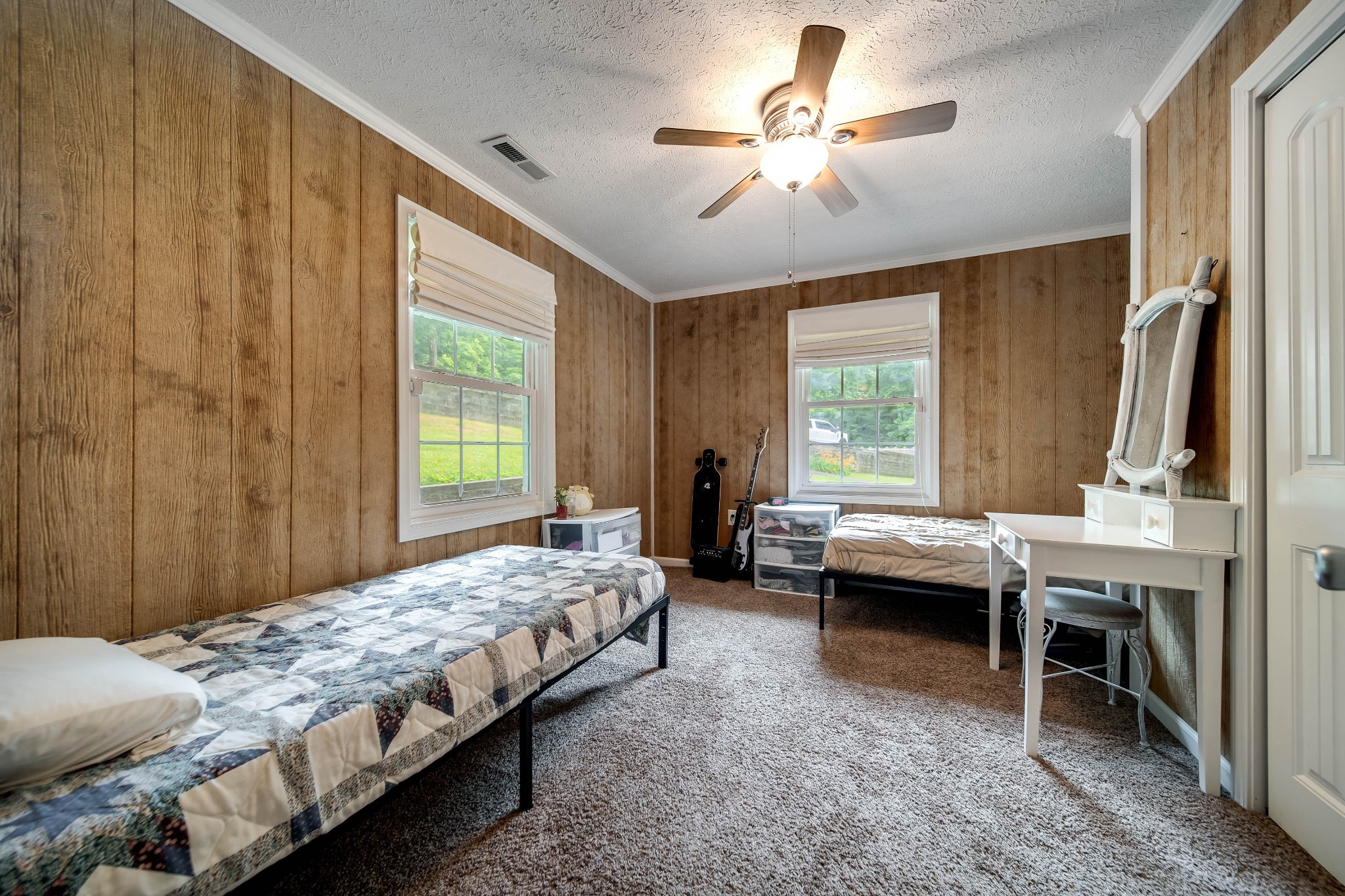 554 Hickman Shores Road Dover, TN 37058 - Photo 21 of 93 a bedroom with a bed and a chandelier