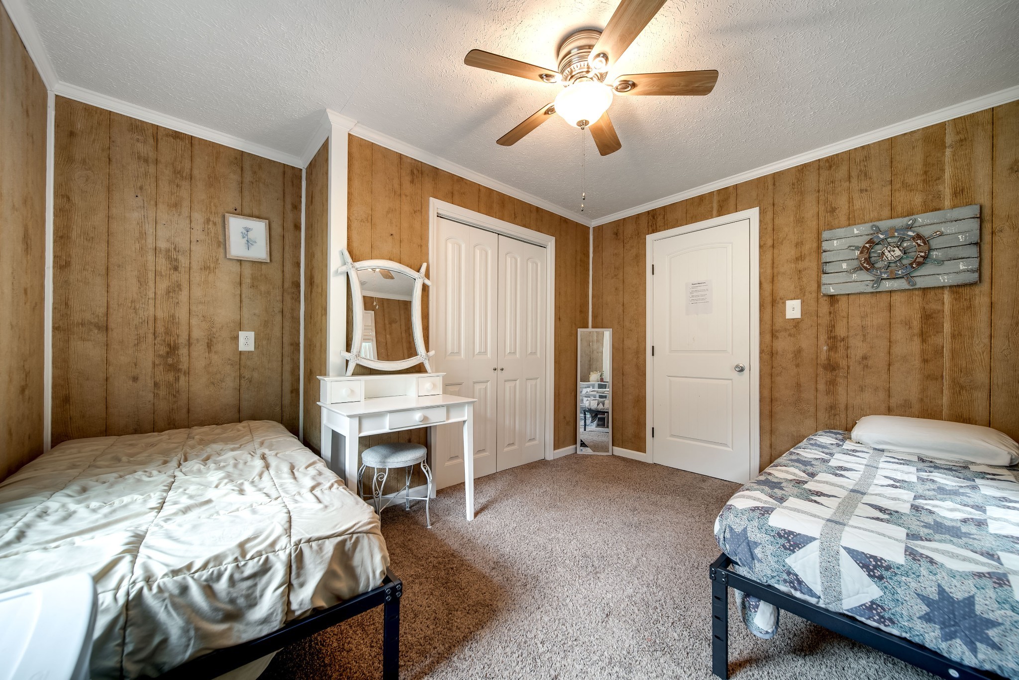 554 Hickman Shores Road Dover, TN 37058 - Photo 22 of 93 a bedroom with a bed and a chandelier