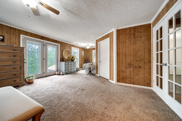 a kitchen with stainless steel appliances kitchen island granite countertop a stove a sink and a microwave