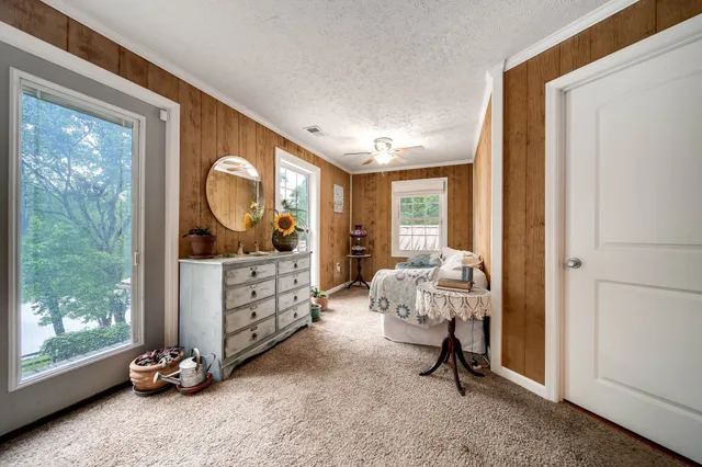 a kitchen with stainless steel appliances granite countertop a stove refrigerator and a dining table with wooden floor