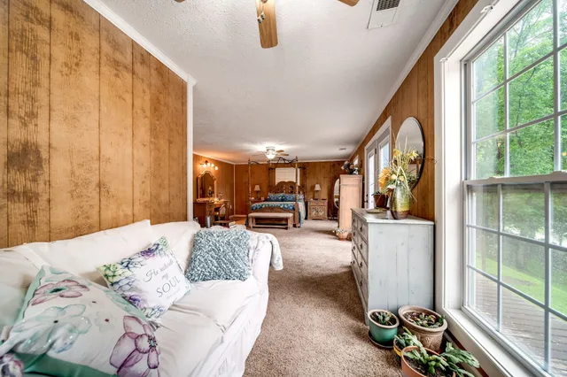 a kitchen with stainless steel appliances granite countertop a sink a stove and a microwave