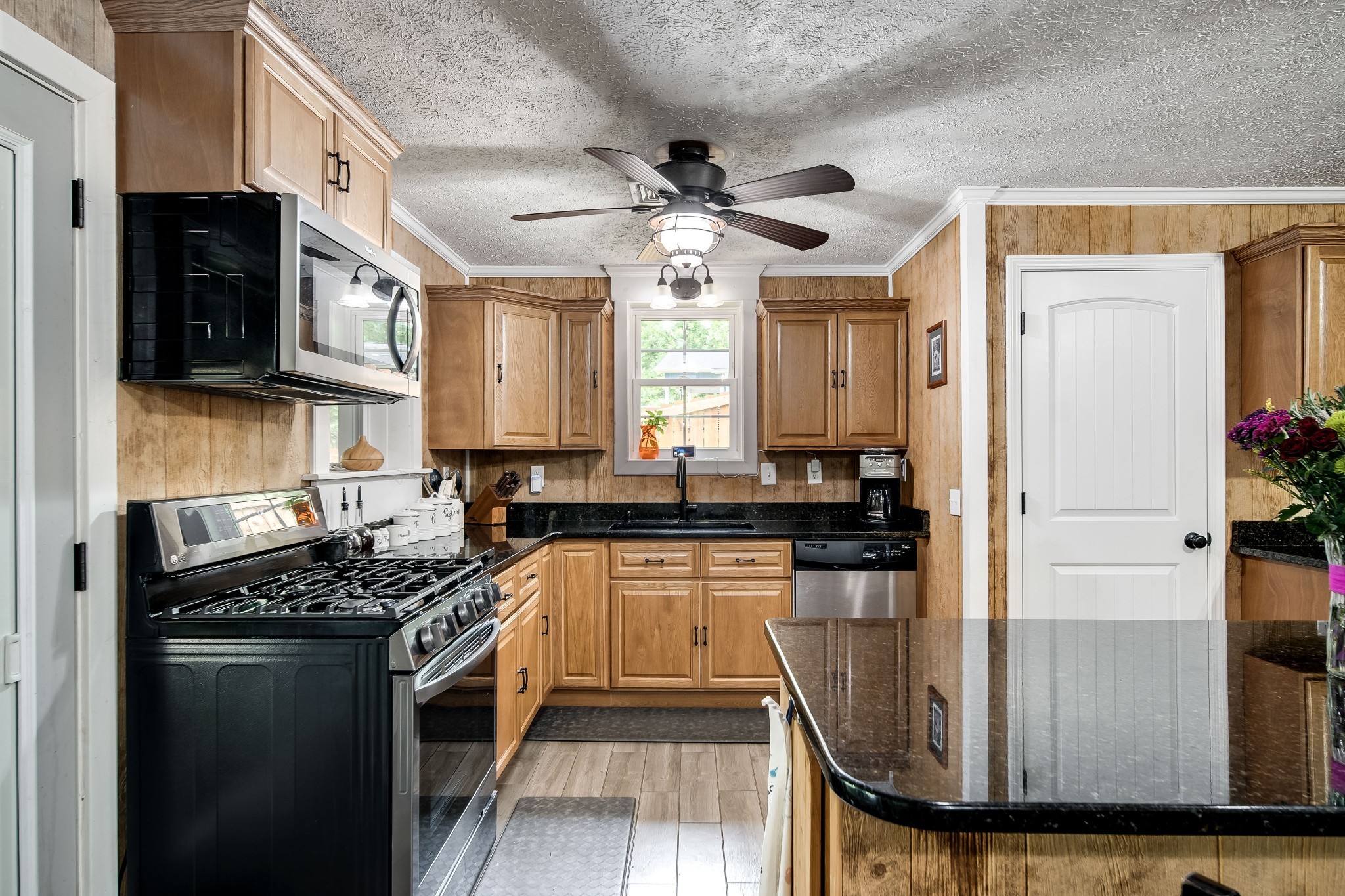 554 Hickman Shores Road Dover, TN 37058 - Photo 51 of 93 a kitchen with stainless steel appliances granite countertop a stove a sink and a refrigerator