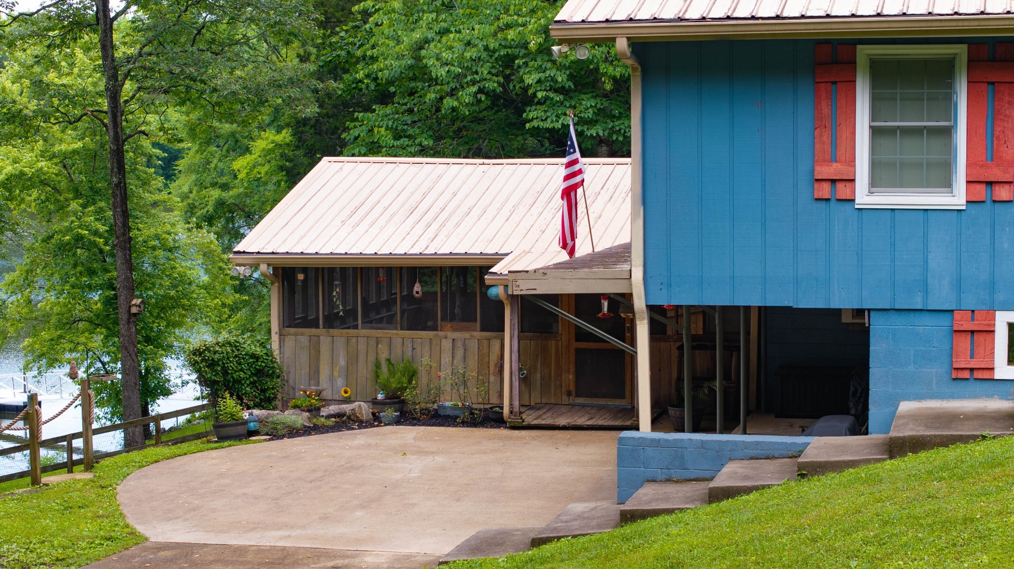 554 Hickman Shores Road Dover, TN 37058 - Photo 79 of 93 a view of a house with a yard potted plants and a tree
