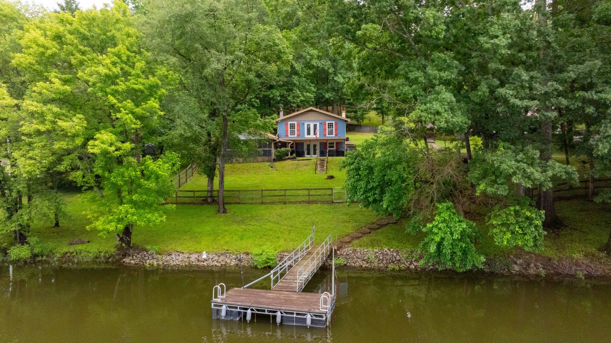 554 Hickman Shores Road Dover, TN 37058 - Photo 81 of 93 a view of a lake with a building in the background