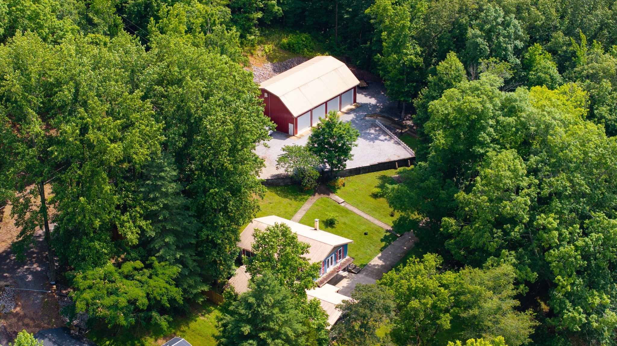 554 Hickman Shores Road Dover, TN 37058 - Photo 90 of 93 an aerial view of a house with a yard and lake view